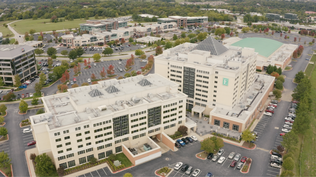 an aerial view of an office building and parking lot.