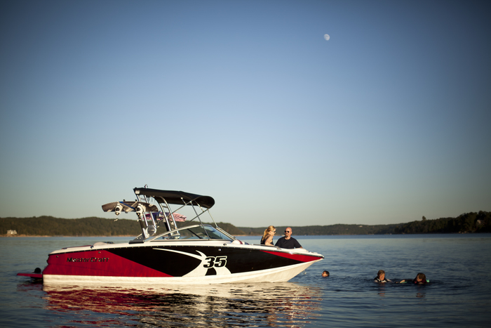 a boat in the water with people on it.