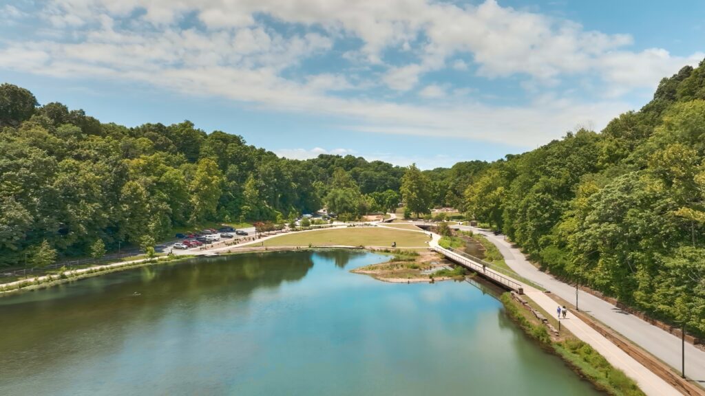 An aerial view of a river surrounded by trees.