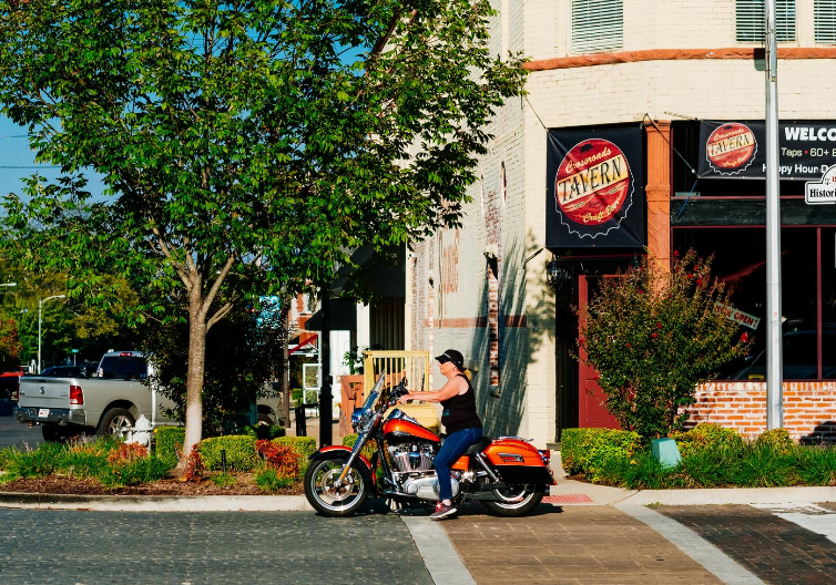 a woman on a motorcycle.