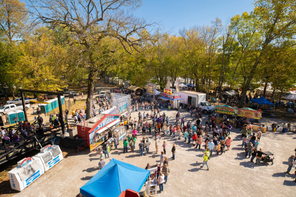 An aerial view of a crowd of people at a festival.