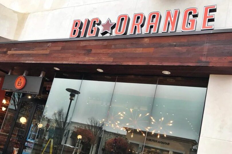 a restaurant with a sign that says big orange.