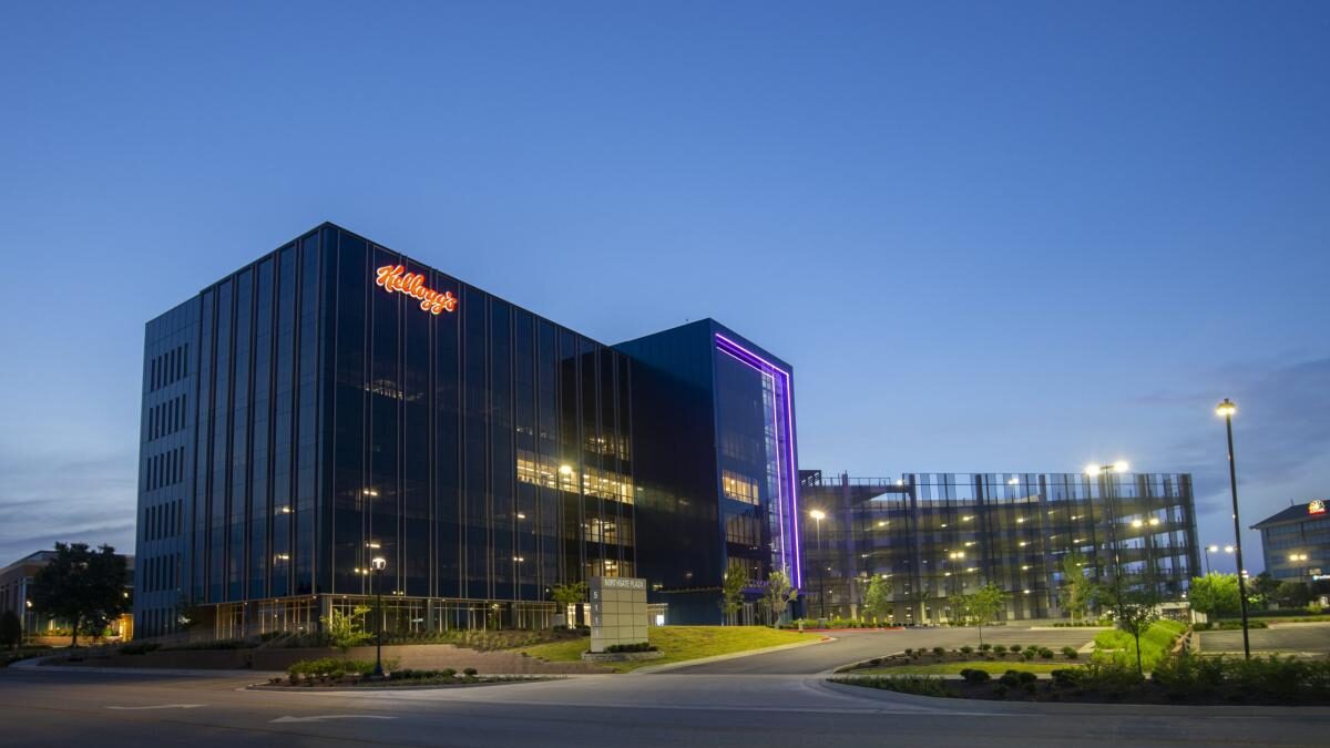 a large office building lit up at night.