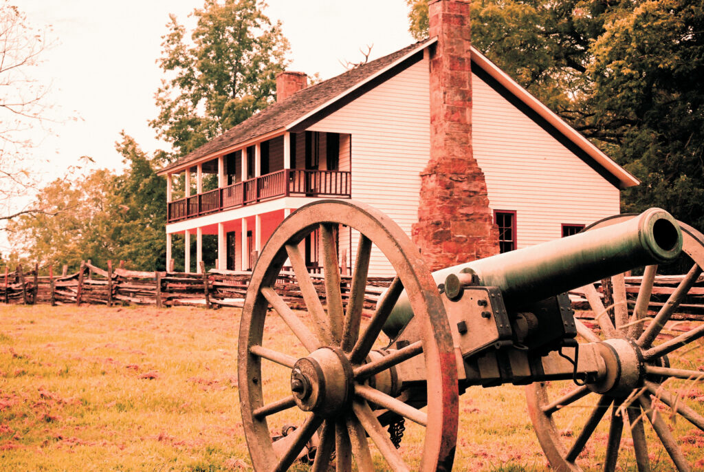 House and cannon at civil war battlefield