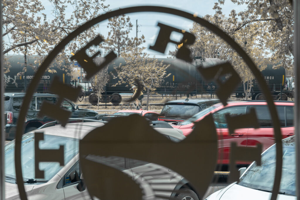 View of Frisco Plaza in Downtown Rogers from interior window of The Rail - A Pizza Company